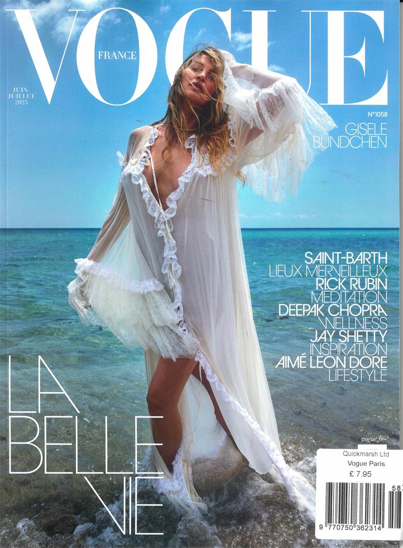 Vogue magazine cover featuring Gisele Bundchen in a white dress by the ocean