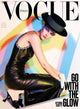 Vogue Italia magaine cover with Victtoria Ceretti in black dress and hat kneeling.