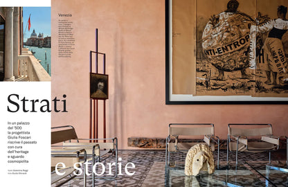 Interior design with pink walls, modern furniture, and a large framed artwork.