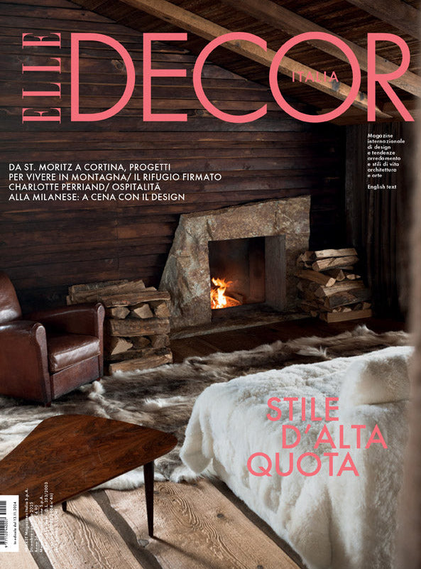 Elle Decor magazine spread featuring interior design with stoves and fireplace.