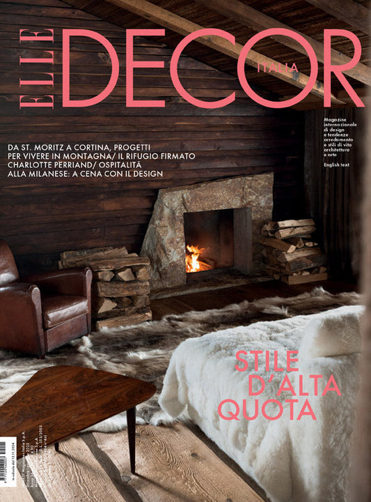 Elle Decor magazine spread featuring interior design with stoves and fireplace.
