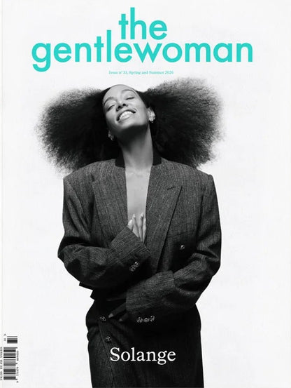 Solange smiling in a suit on the cover of The Gentlewoman