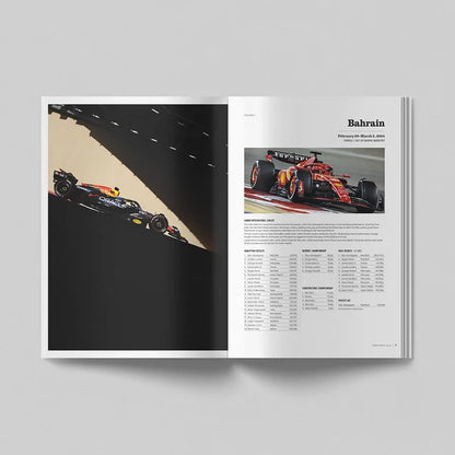 An open magazine or brochure spread on a light gray background. The left page shows a dramatic racing photograph of a black Formula 1 car on a track, and the right page has a smaller racing photo with the heading 'Bahrain' and a table of race results below.