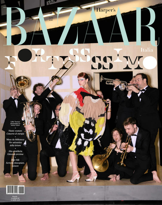 Harper's Bazaar Italia magazine cover with a woman in a colorful dress surrounded by musicians.