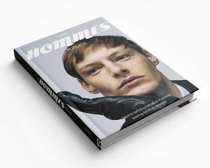 Book titled 'Les Hommes Publics' with a cover featuring Robert Sipos' face on a white background