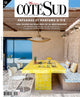Cover of Maison du Coté Sud magazine, issue number 219 from June 2026, featuring a bright Mediterranean outdoor dining scene with a yellow tiled table, white chairs, patterned cushions, and a blue sea view in the background.