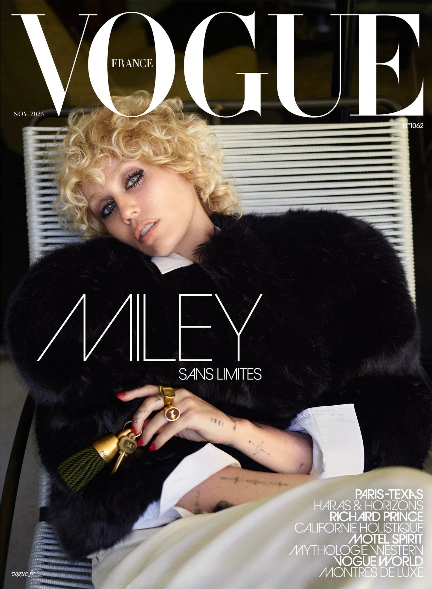 Vogue magazine cover featuring Miley Cyrus in a black fur coat sitting down.