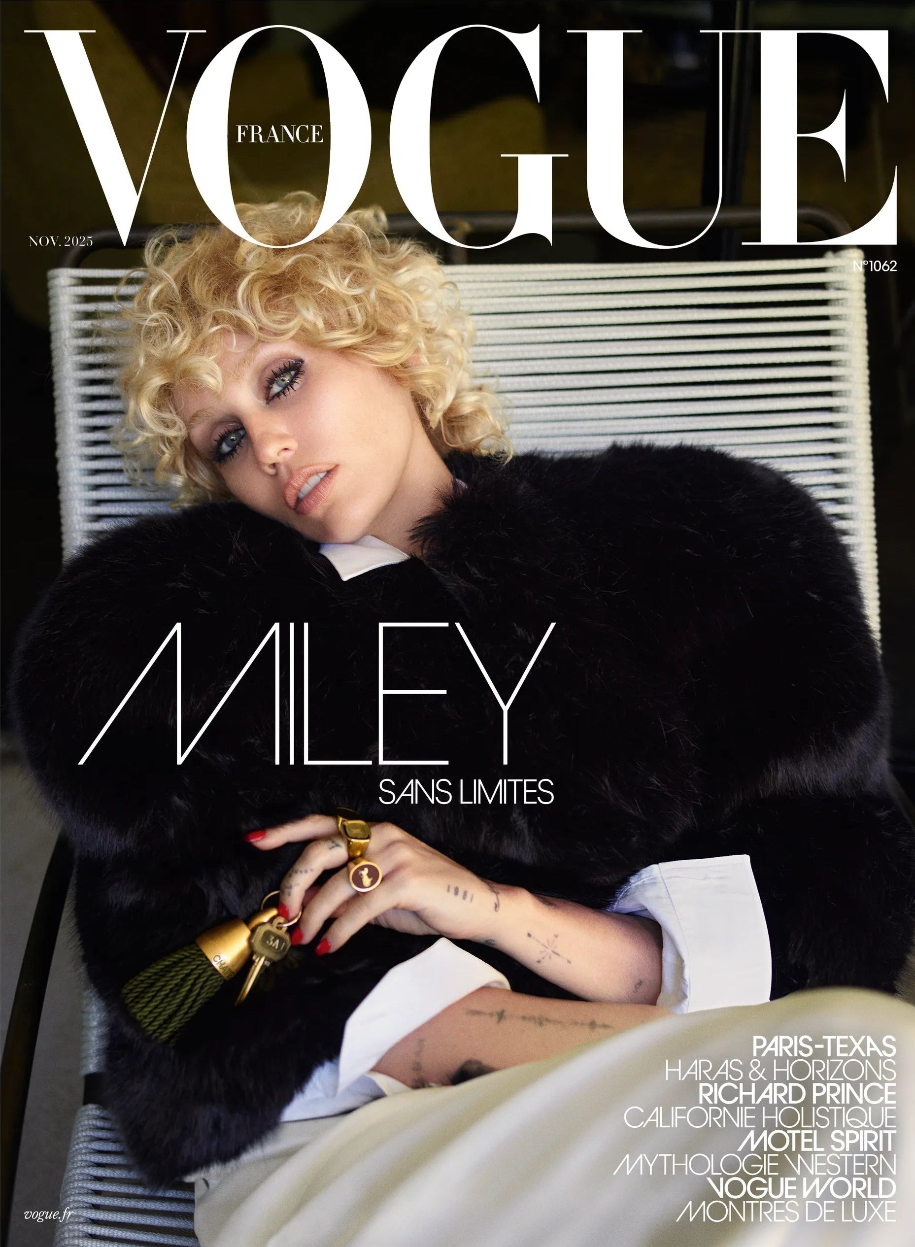 Vogue magazine cover featuring Miley Cyrus in a black fur coat sitting down.