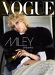 Vogue magazine cover featuring Miley Cyrus in a black fur coat sitting down.