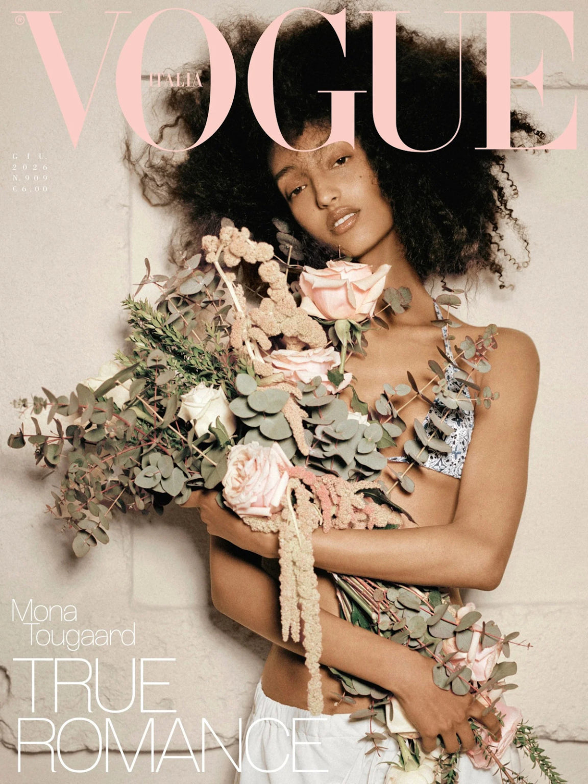 Mono Tougaard on Vogue Italia Magazine wearing bikini holding bouquet leaning on blank wall.