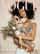 Mono Tougaard on Vogue Italia Magazine wearing bikini holding bouquet leaning on blank wall.