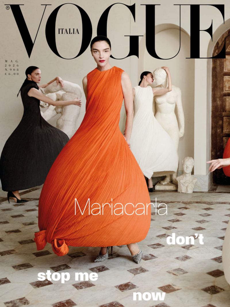 Vogue Italia magazine cover featuring Mariacarla in a dramatic pleated orange sleeveless gown.